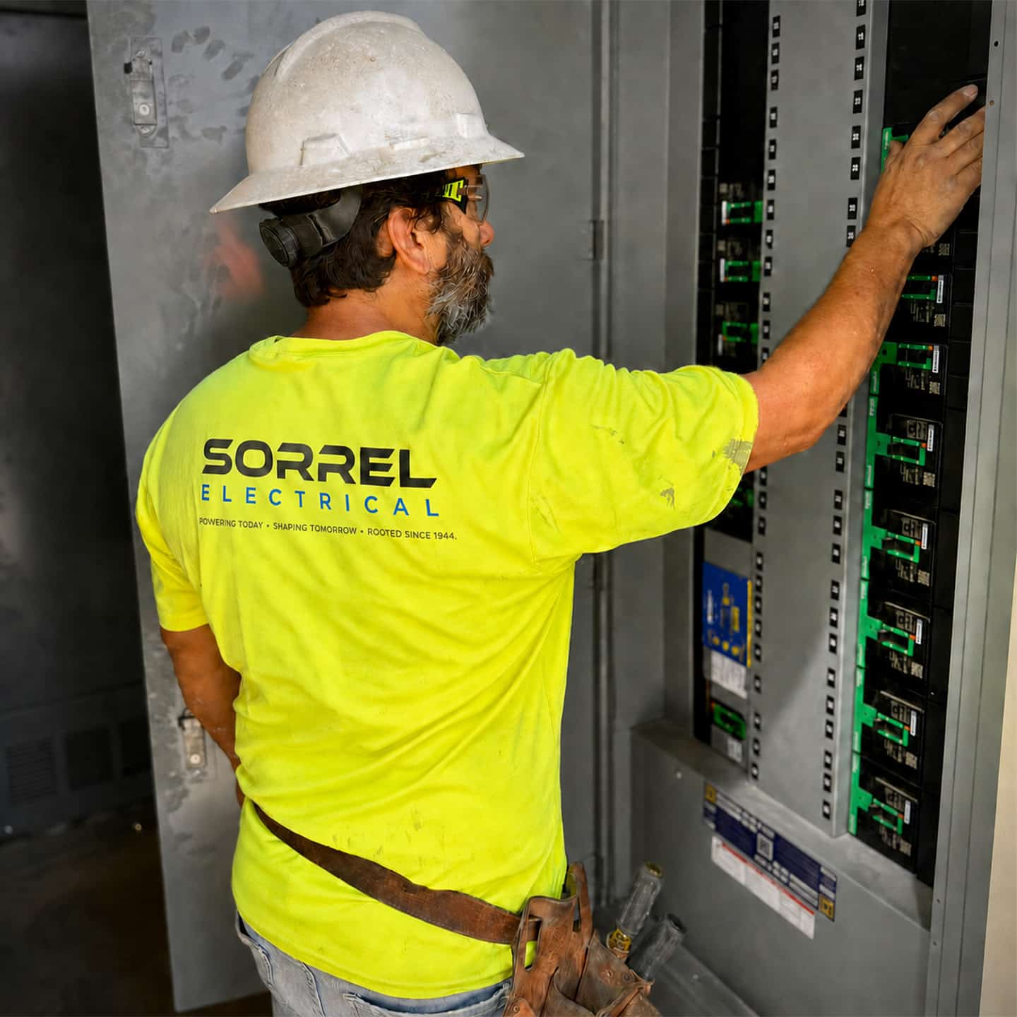 Sorrel Electrical technician inspecting electrical equipment during scheduled maintenance.